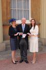 Colin Squire with his daughters Sarah and Elizabeth at Buckingham Palace.